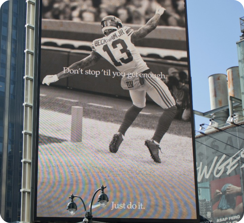 A billboard advert showing a woman wearing a facemask